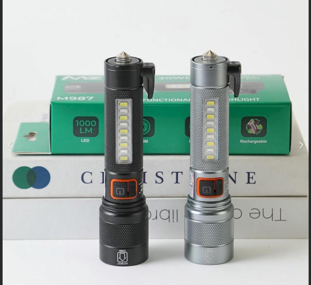 M987 (RECHARGEABLE LED METAL TORCH) 80W + 30W COB with 1500mAh Battery, 5 Modes with Hammer and Seatbelt cutter Zoomable.